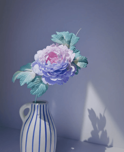 Lace-thread Peony crochet flower in pink and lilac with mint leaves in a striped vase — flower gallery on crochet